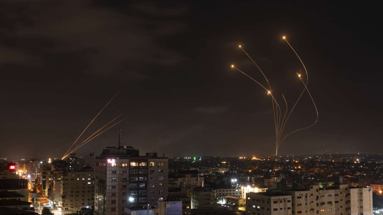 Rockets fired from Gaza and intercepted by Israel's Iron Dome anti-missile system over Israeli skies are seen from Gaza City, on May 13, 2023. Israel and Hamas agreed to pause the devastating war in the Gaza Strip, mediators announced Wednesday.