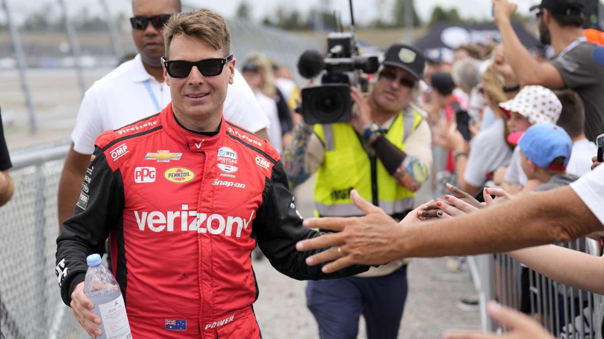 FILE - Will Power greets fans before an IndyCar auto race at the Nashville Superspeedway in Lebanon, Tennesee, Sept. 15, 2024.