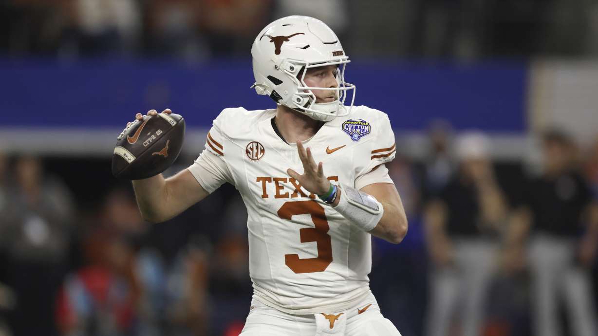Texas quarterback Quinn Ewers (3) passes against Ohio State during the first half of the Cotton Bowl College Football Playoff semifinal game, Friday, Jan. 10, 2025, in Arlington, Texas.