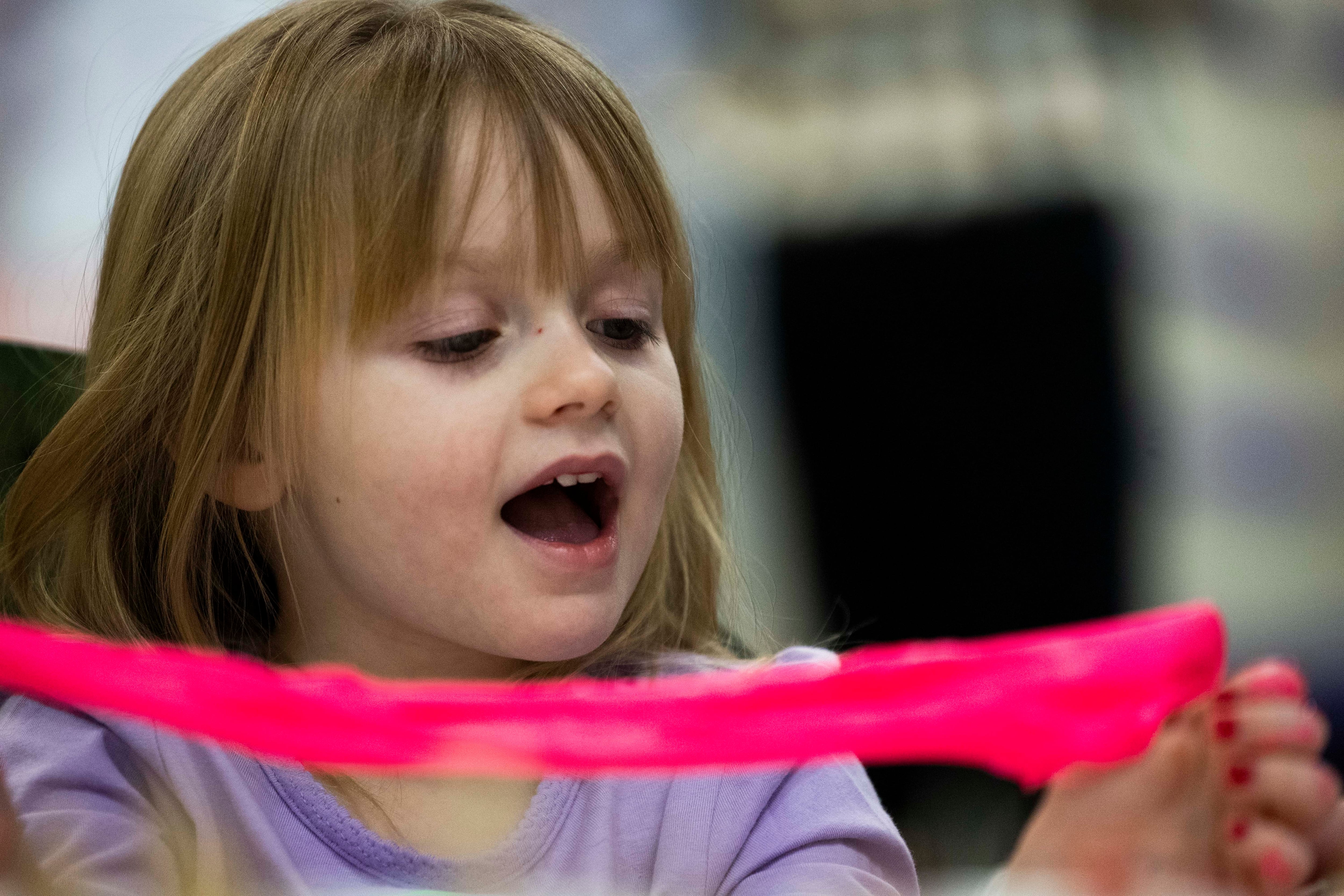 Rae Gayler, 4, approves of the stretchiness of slime as she plays during a visit from Utah Jazz coaches and players to Intermountain Primary Children’s Hospital in Salt Lake City on Tuesday.