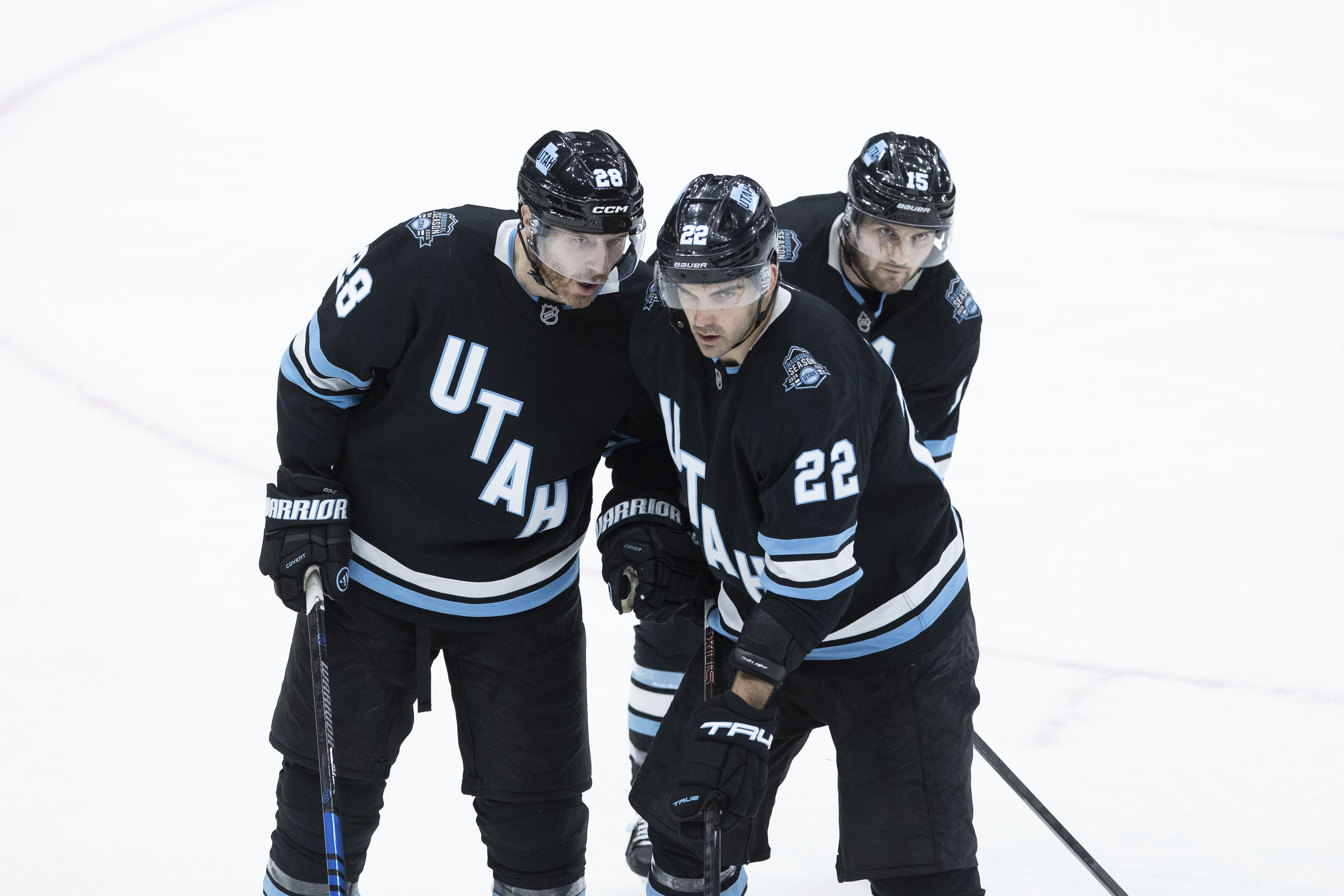 Utah Hockey Club defenseman Ian Cole (28), center Jack McBain (22) and center Alexander Kerfoot (15) on the ice during the game against the Florida Panthers during the third period of an NHL hockey game, Wednesday, Jan. 8, 2025, in Salt Lake City.