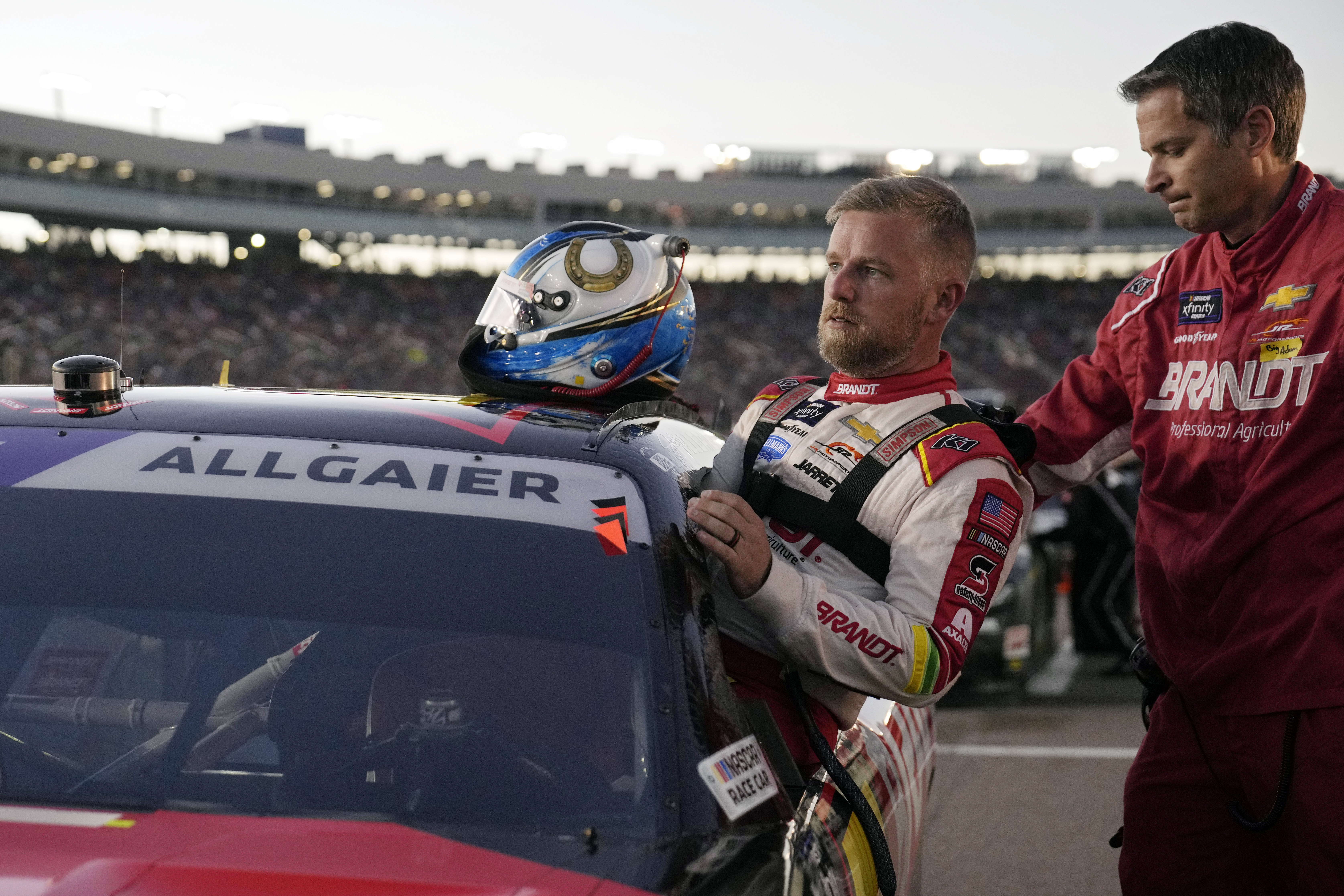 FILE - Driver Justin Allgaier gets in his car before a NASCAR Xfinity Series auto race, Saturday, Nov. 9, 2024, in Avondale, Ariz.