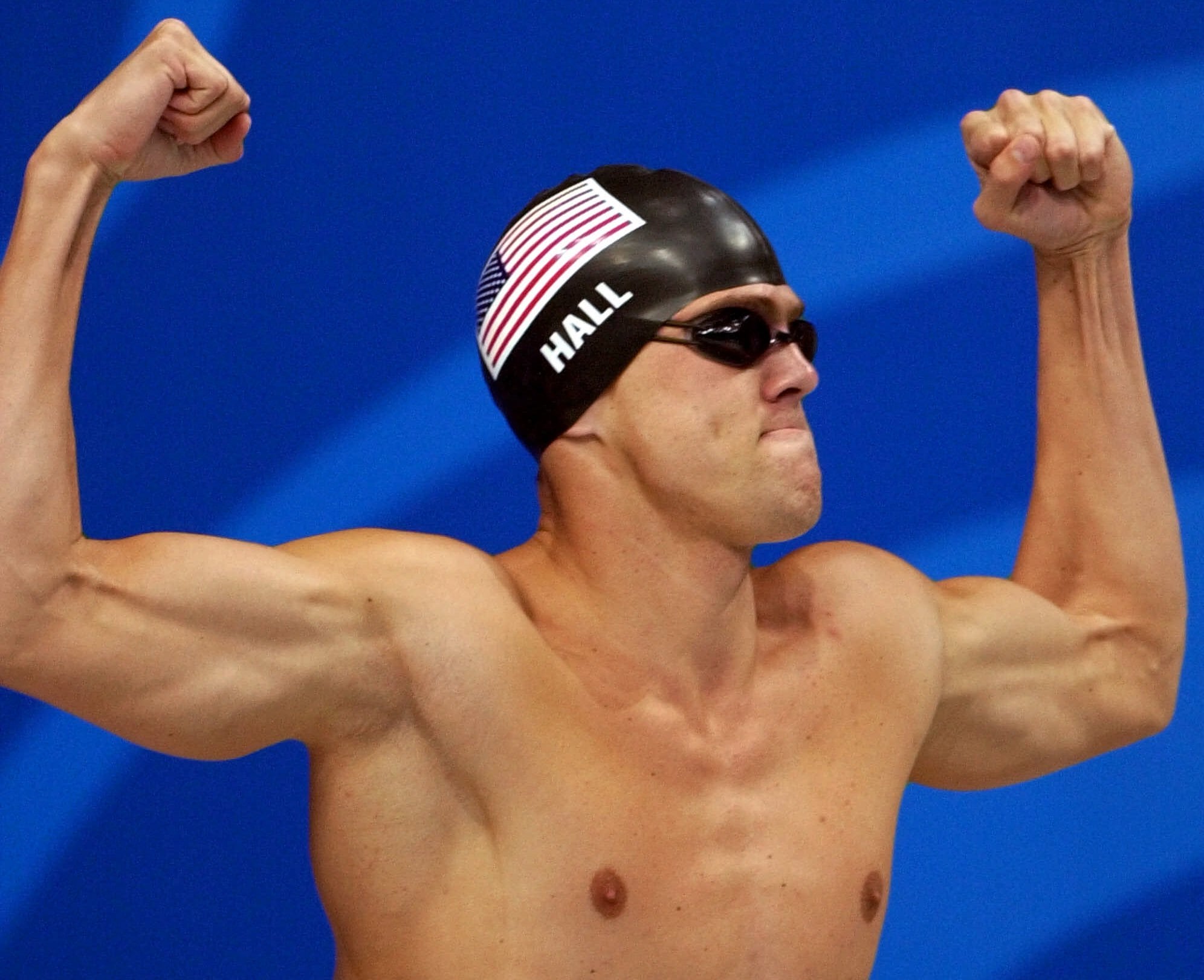 U.S. swimmer Gary Hall Jr. flexes for the crowd prior to competing in the men's 50-meter freestyle Sept. 22, 2000, at the Sydney International Aquatic Center during the Summer Olympics in Sydney. Hall Jr. tied with his teammate Anthony Ervin for the gold medal.