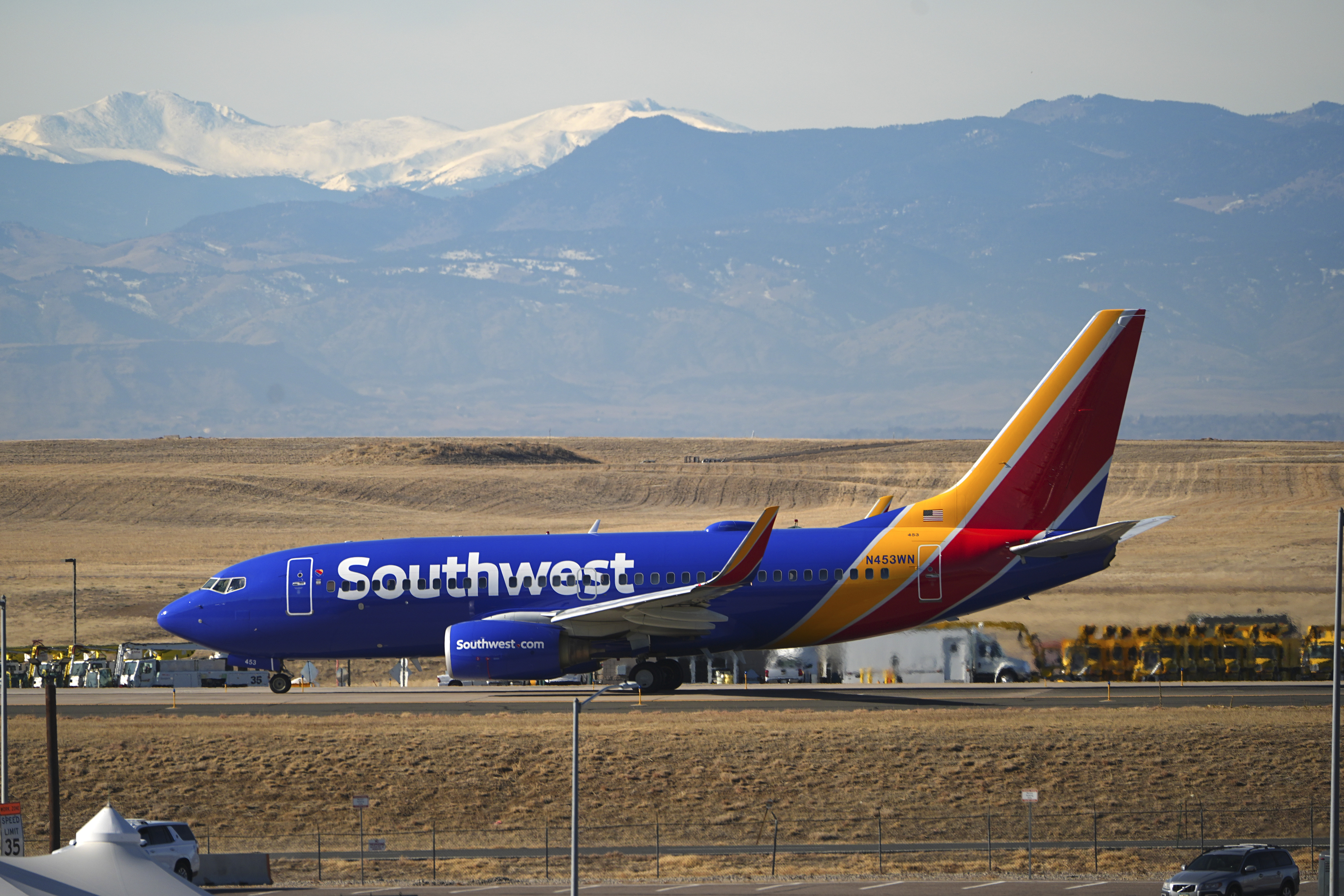 Southwest Airlines jetliner taxis down a runway for take off at Denver International Airport, Dec. 24, 2024. The Transportation Department filed a civil lawsuit against Southwest for "chronically delayed flights" Wednesday.