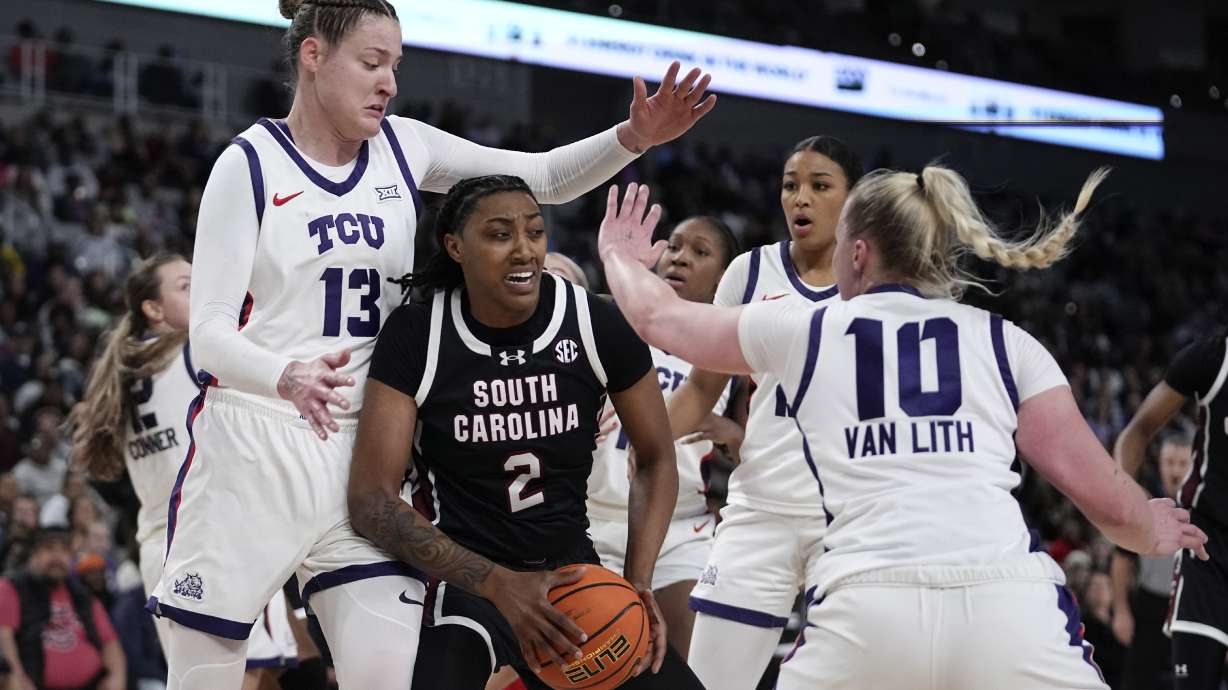 FILE - South Carolina forward Ashlyn Watkins (2) works to pass the ball as TCU 's Sedona Prince (13) and Hailey Van Lith (10) defend in the second half of an NCAA college basketball game in Fort Worth, Texas, Sunday, Dec. 8, 2024.