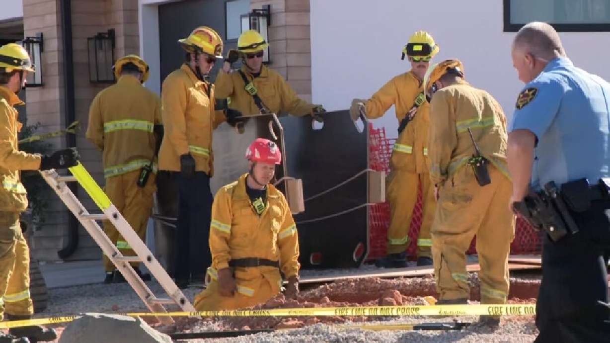 St. George fire and rescue crews at the site of an apparent trench collapse outside a home in the city on Wednesday, trying to recover the body of a 54-year-old man who died in the incident.