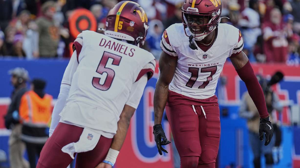 FILE - Washington Commanders wide receiver Terry McLaurin (17) celebrates with quarterback Jayden Daniels (5) after scoring a touchdown against the New York Giants during the second quarter of an NFL football game, Nov. 3, 2024, in East Rutherford, N.J.