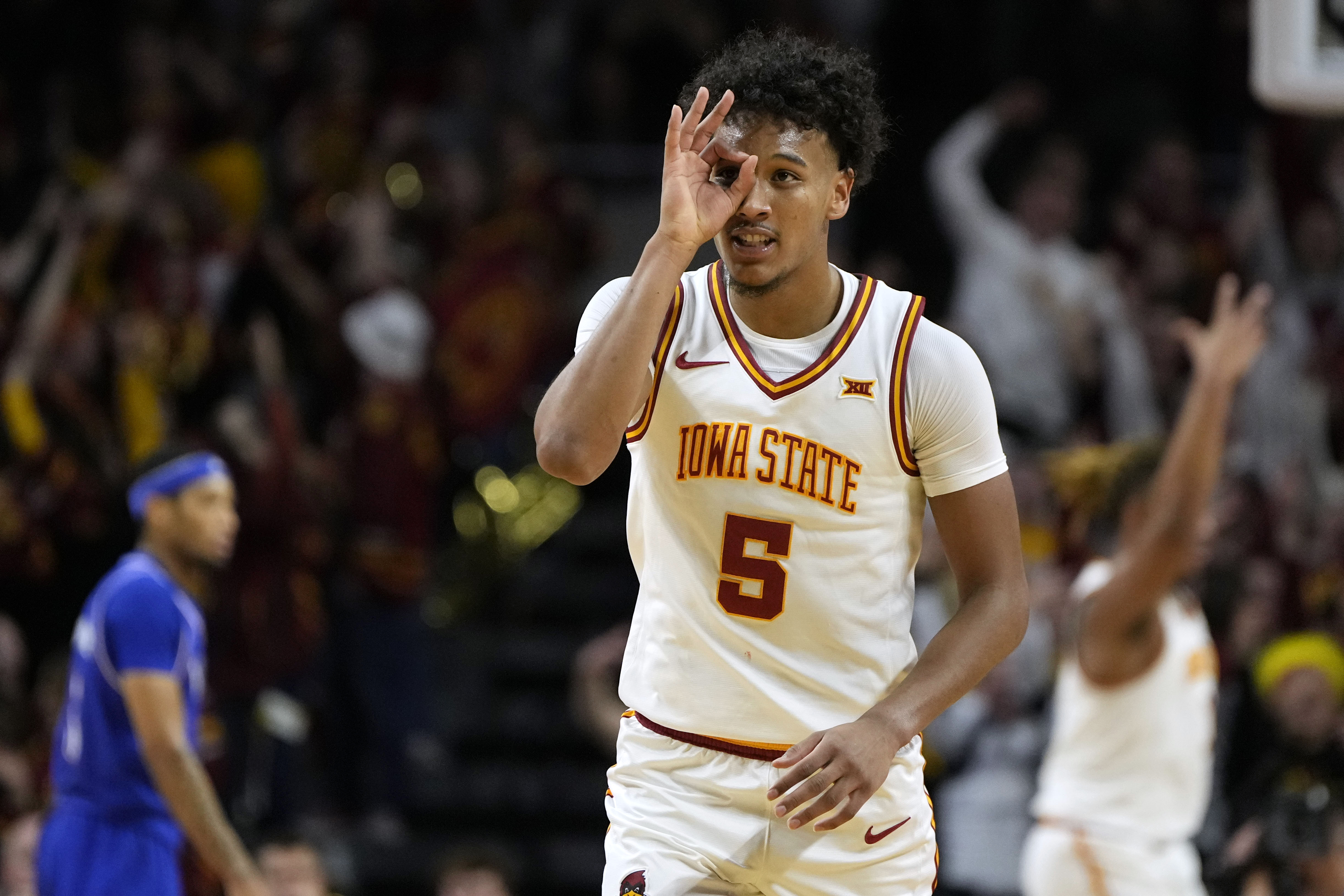 Iowa State guard Curtis Jones celebrates after making a three-point basket during the first half of an NCAA college basketball game against Kansas Wednesday, Jan. 15, 2025, in Ames, Iowa.