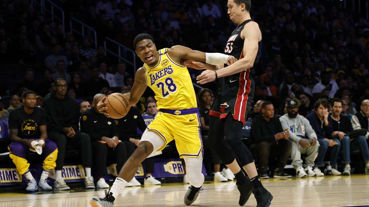 Los Angeles Lakers forward Rui Hachimura is pressured by Miami Heat forward Duncan Robinson during the first half of an NBA basketball game Wednesday, Jan. 15, 2025, in Los Angeles.