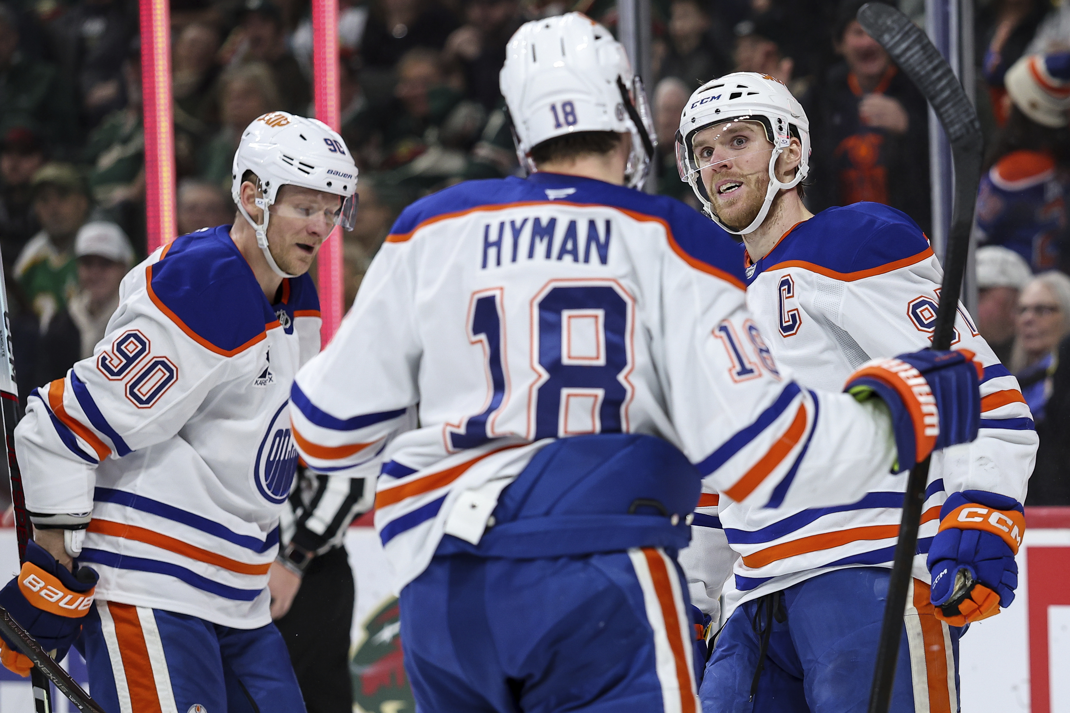 Edmonton Oilers center Connor McDavid, right, celebrates his goal with teammates during the third period of an NHL hockey game against the Minnesota Wild Wednesday, Jan. 15, 2025, in St. Paul, Minn.