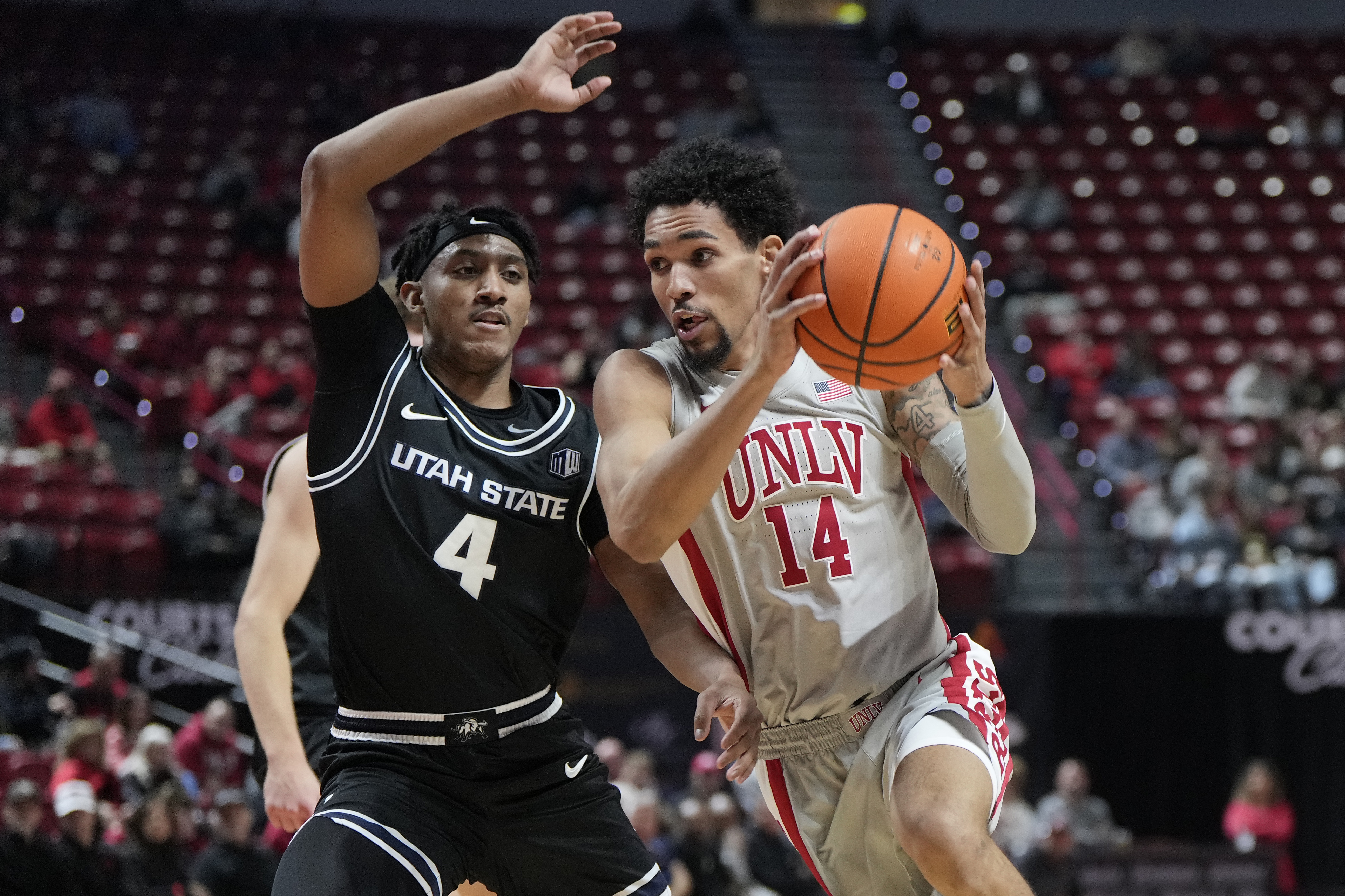 UNLV scores final 7 points to beat No. 22 Utah State 65-62