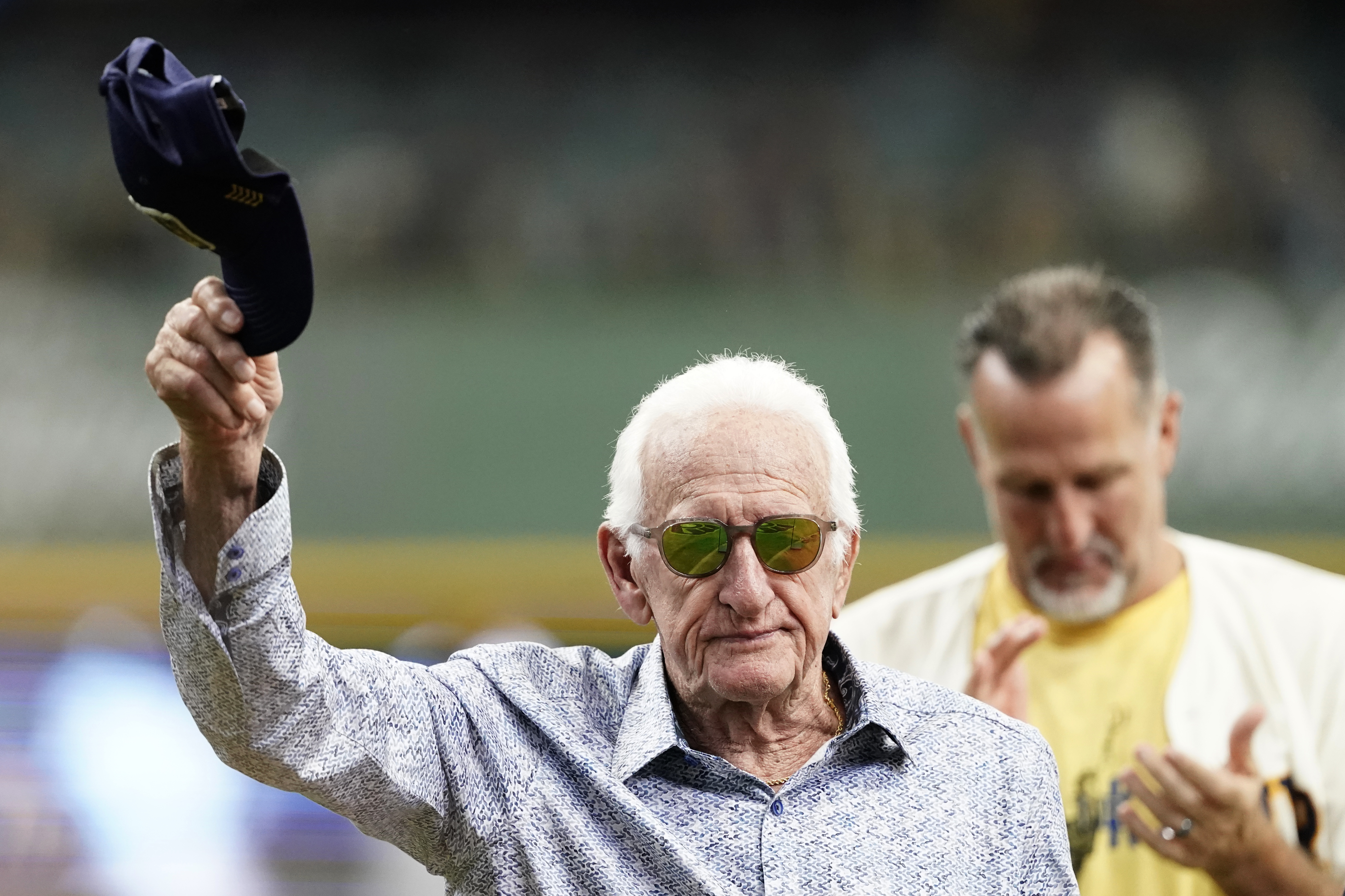 FILE - Milwaukee Brewers radio announcer Bob Uecker tips his cap before a baseball game between the Milwaukee Brewers and the Miami Marlins,, July 28, 2024, in Milwaukee.