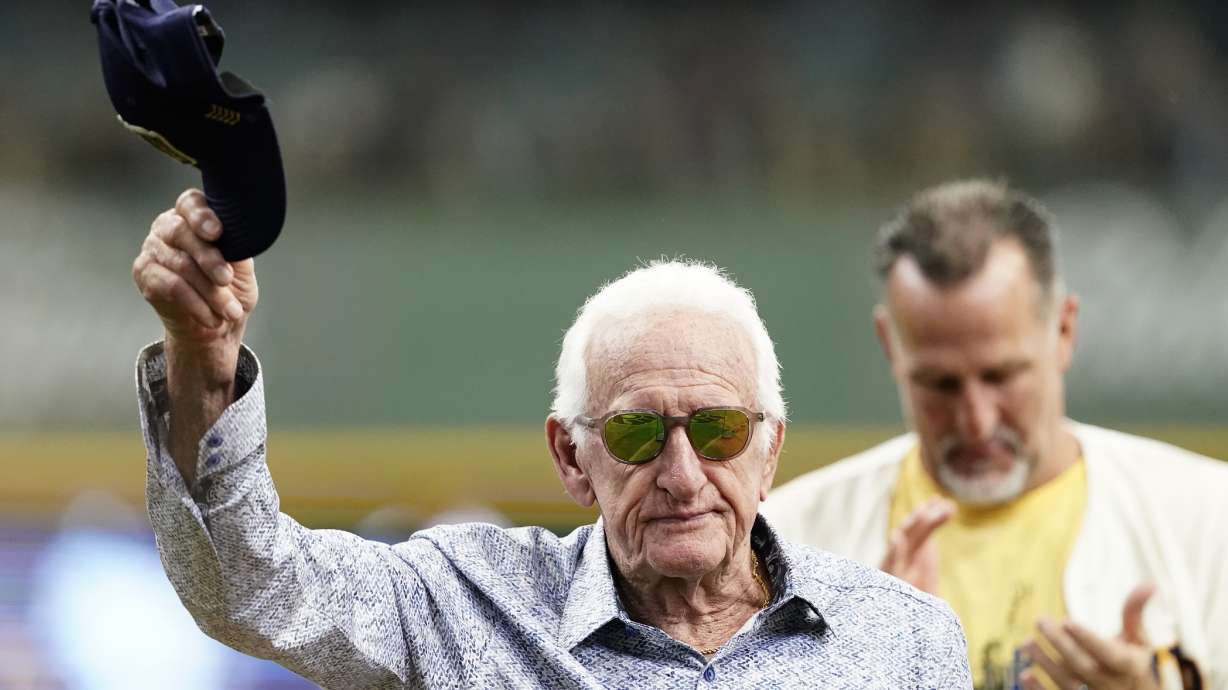 FILE - Milwaukee Brewers radio announcer Bob Uecker tips his cap before a baseball game between the Milwaukee Brewers and the Miami Marlins,, July 28, 2024, in Milwaukee.
