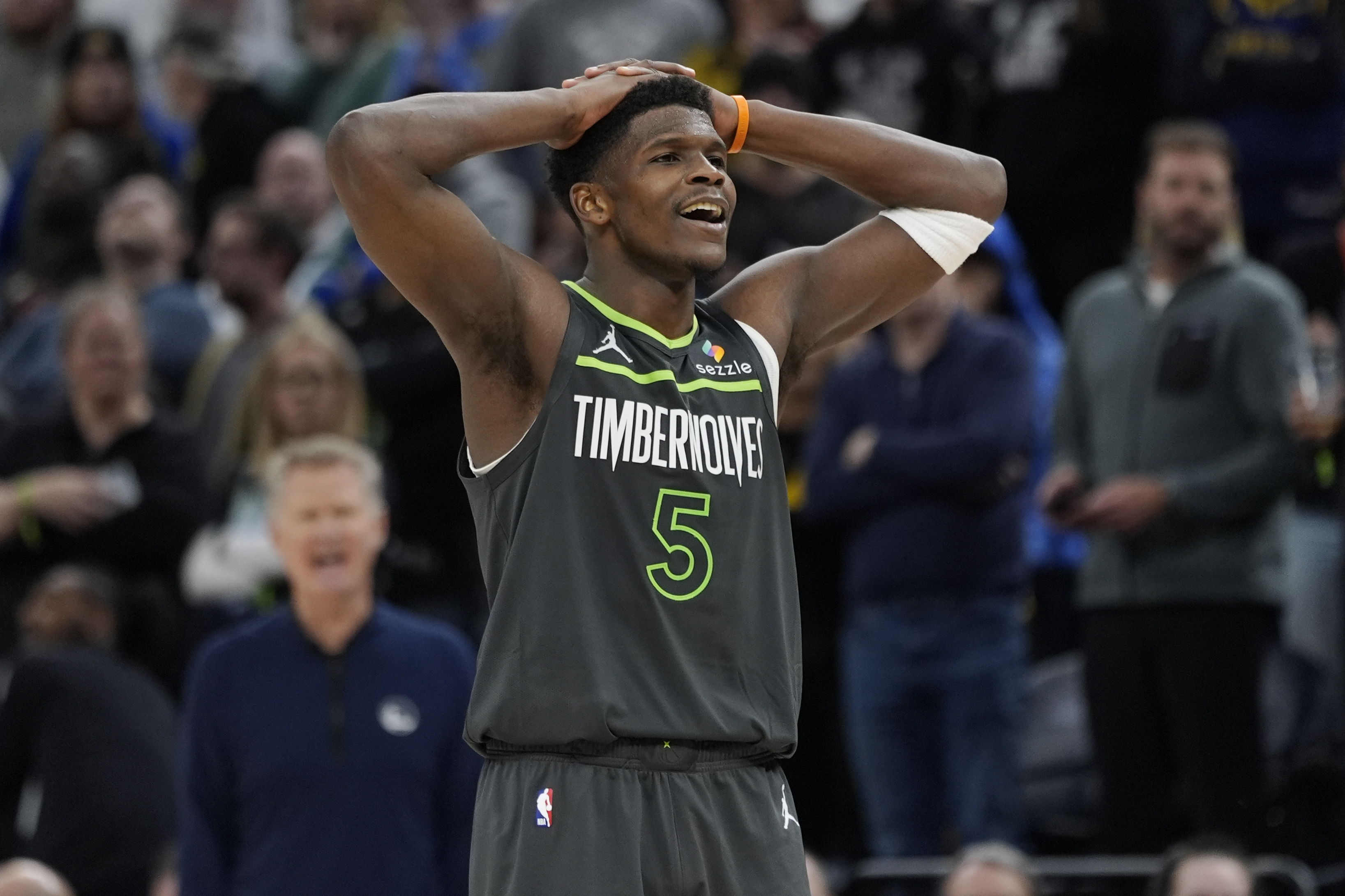 Minnesota Timberwolves guard Anthony Edwards (5) reacts during the seconds of an NBA basketball game against the Golden State Warriors, Wednesday, Jan. 15, 2025, in Minneapolis.