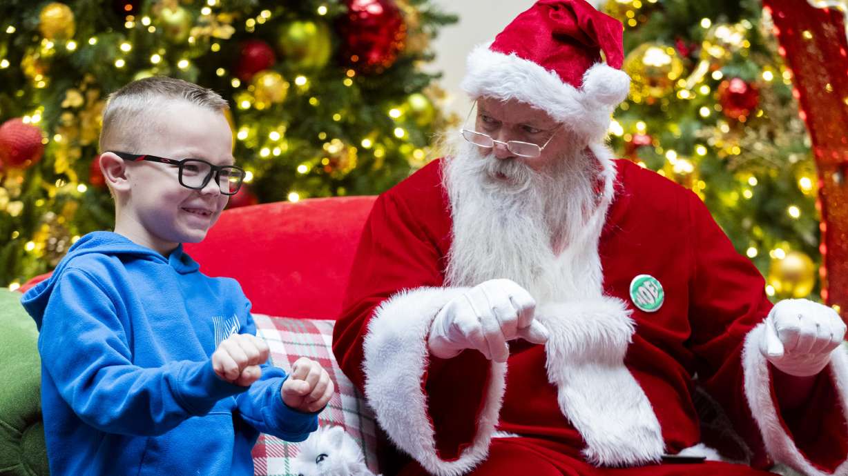 Ryker Fisher, 7, talks with Santa Rich about how he would like an electric motorcycle for Christmas, on a Sensory Sunday at the Layton Hills Mall in Layton on Dec. 15, 2024.