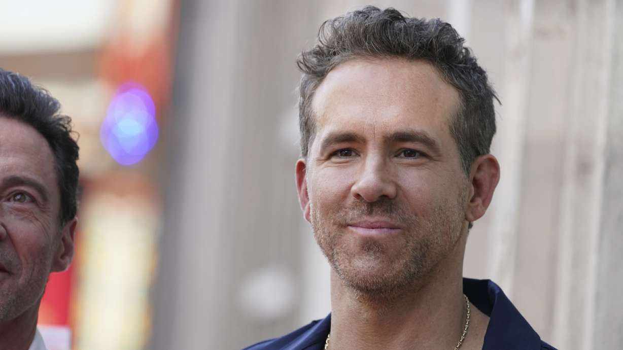 FILE - Ryan Reynolds attends a ceremony honoring Kevin Feige with a star on the Hollywood Walk of Walk of Fame, July 25, 2024, in Los Angeles.