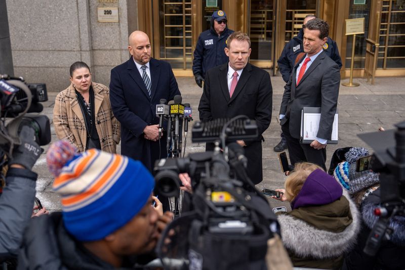 Attorney Joseph Cammarata and Andrew Giuliani, son of former New York City Mayor Rudy Giuliani, speak during a press conference at the United States District Court in Manhattan. Rudy Giuliani, although not present, reached a settlement agreement with two Georgia election workers that he defamed, in New York City, Thursday.