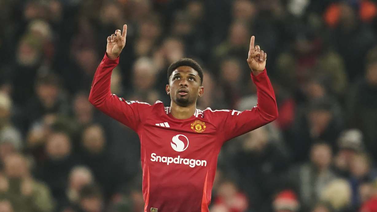 Manchester United's Amad Diallo celebrates after scoring his side's first goal during the English Premier League soccer match between Manchester United and Southampton at the Old Trafford stadium in Manchester, England, Thursday, Jan. 16, 2025.