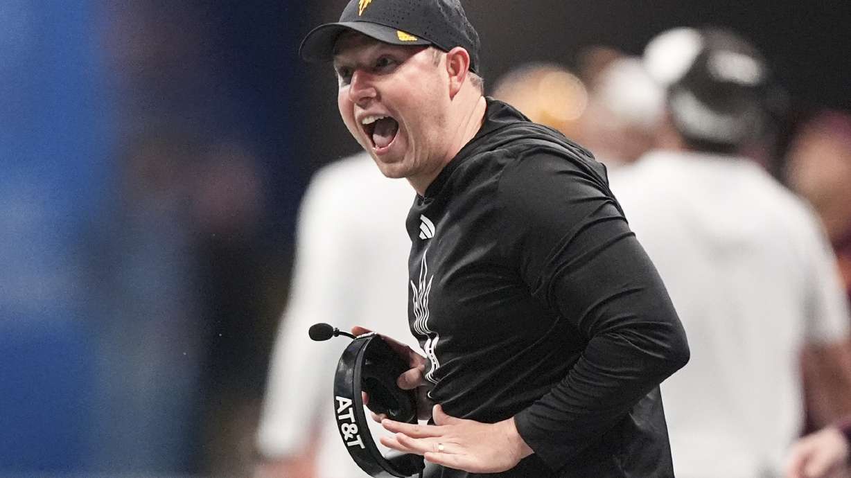 Arizona State head coach Kenny Dillingham speaks with an oficial during the second half in the quarterfinals of a College Football Playoff against Texas, Wednesday, Jan. 1, 2025, in Atlanta.