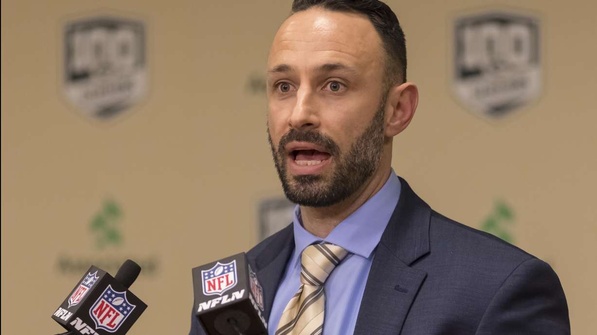 FILE - Jon-Eric Sullivan, Green Bay Packers director of college scouting, talks in Green Bay, Wis., Thursday, April 26, 2018, about the team's pick in the first round of the NFL football draft.