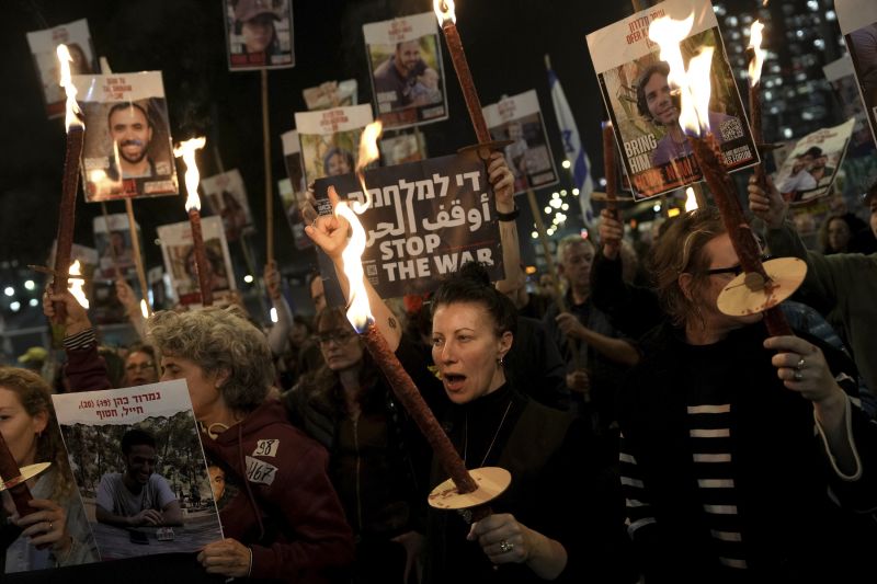 Relatives and friends of people killed and abducted by Hamas and taken into Gaza, react to the ceasefire announcement as they take part in a demonstration in Tel Aviv, Israel, Wednesday.