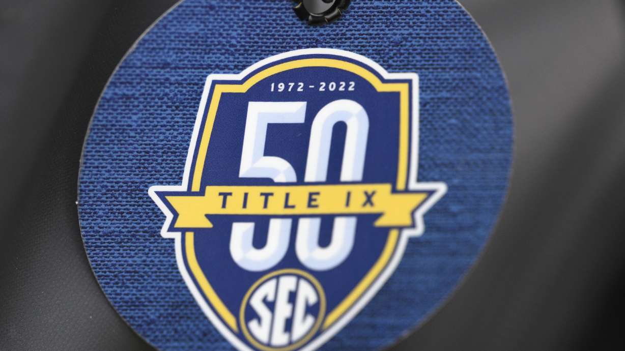 FILE - A luggage tag with a Southeastern Conference Title IX logo is viewed during an NCAA college softball game between South Carolina and Kennesaw State, March 1, 2024, in Orlando, Fla.