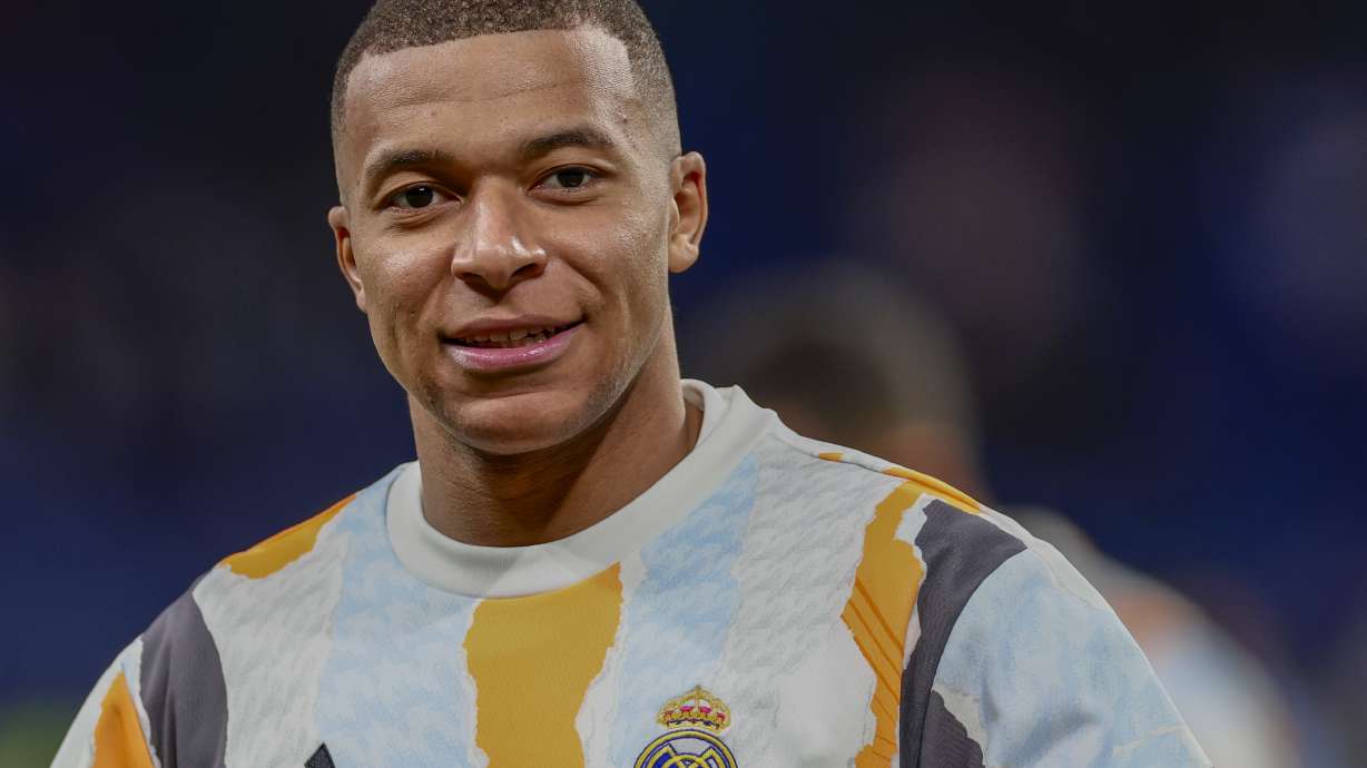 Real Madrid's Kylian Mbappe warms up prior to a Copa del Rey round of 16 soccer match against Celta de Vigo at the Santiago Bernabeu stadium in Madrid, Spain, Thursday, Jan. 16, 2025.