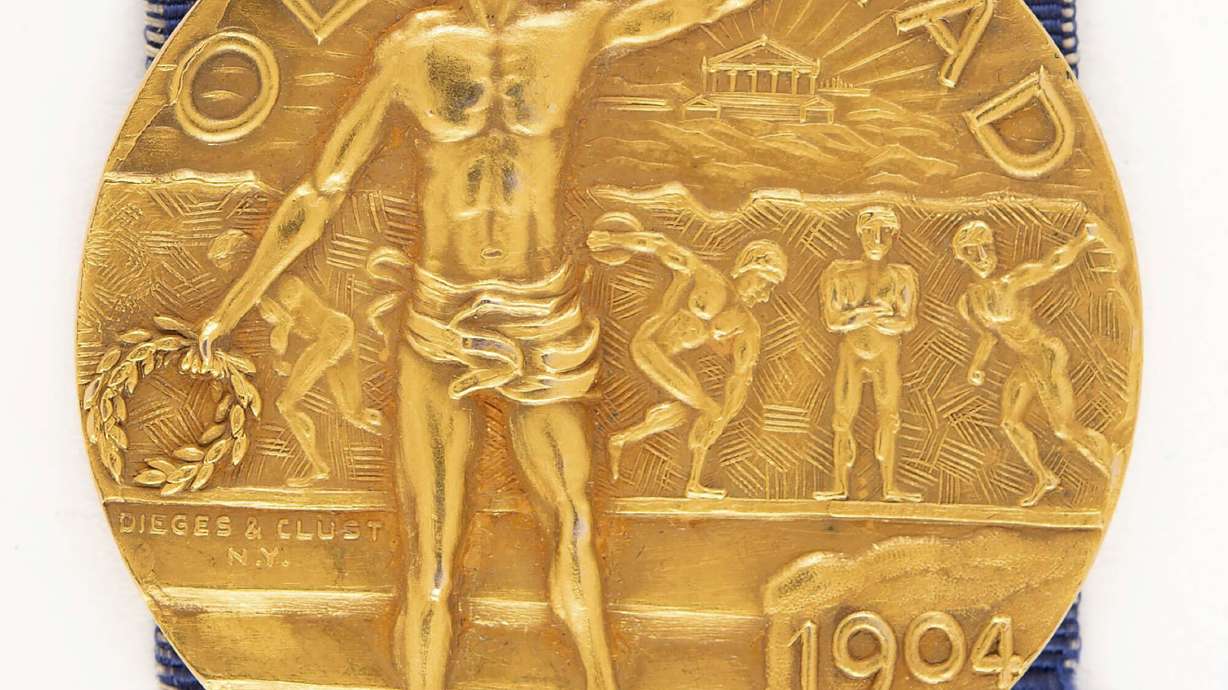 This Nov. 2024 image provided by RR Auction shows a rare gold medal from the 1904 Olympics at the intake office of RR Auction, in Amherst, N.H.