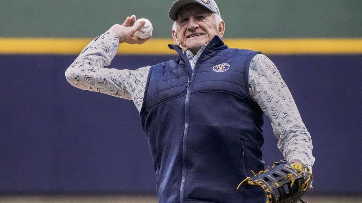 FILE - Bob Uecker throws the ceremonial first pitch before Game 1 of the National League wildcard baseball game between the Milwaukee Brewers and the Arizona Diamondbacks Tuesday, Oct. 3, 2023, in Milwaukee.