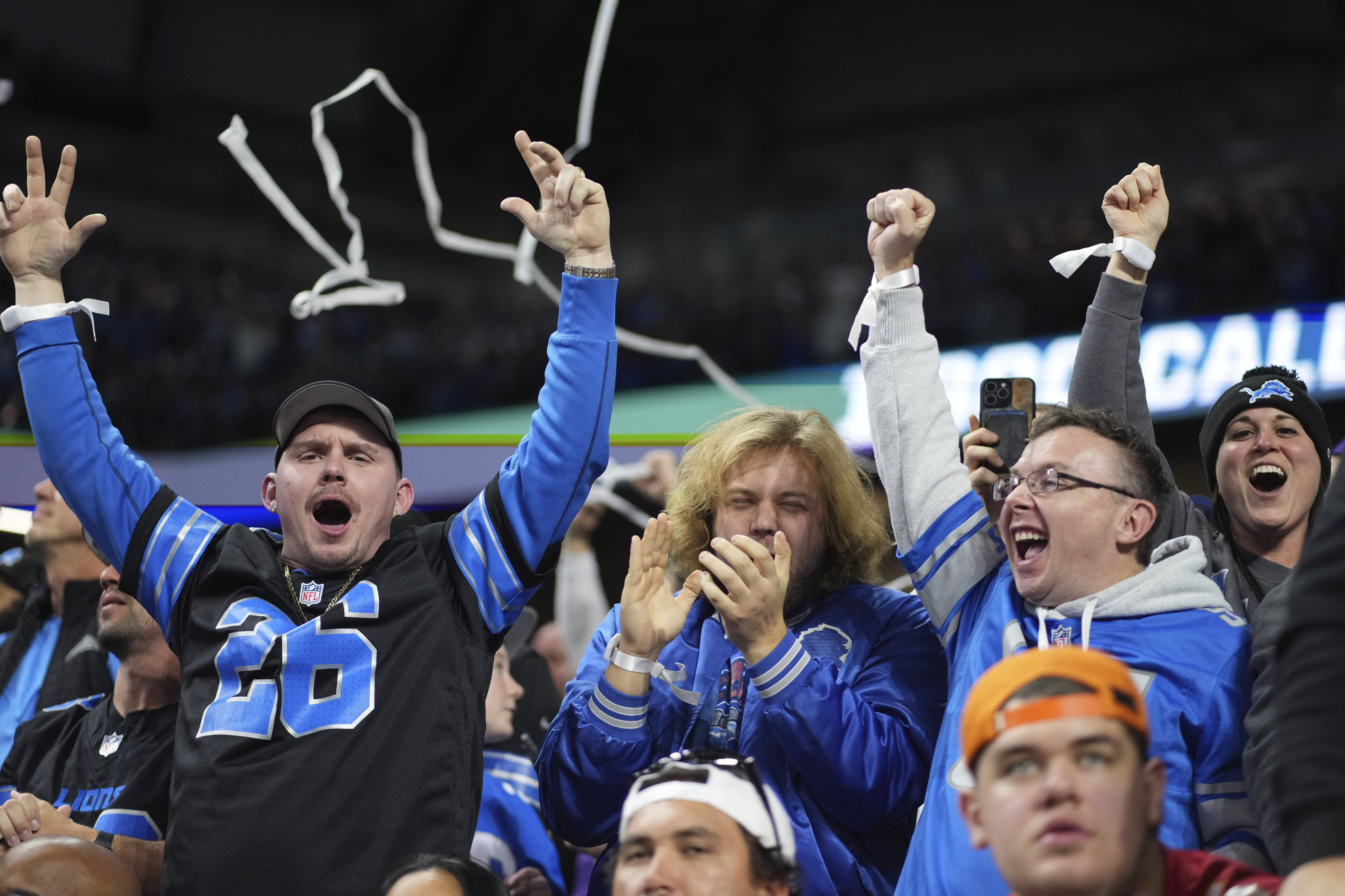 Detroit Lions fans celebrate a touchdown during the second half of an NFL football game between the Detroit Lions and the Minnesota Vikings, Sunday, Jan. 5, 2025, in Detroit.