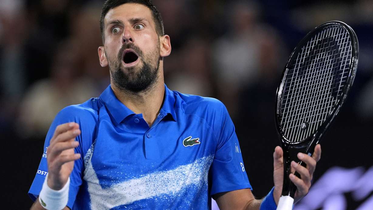 Novak Djokovic of Serbia reacts during his third round match against Tomas Machac of the Czech Republic at the Australian Open tennis championship in Melbourne, Australia, Friday, Jan. 17, 2025.