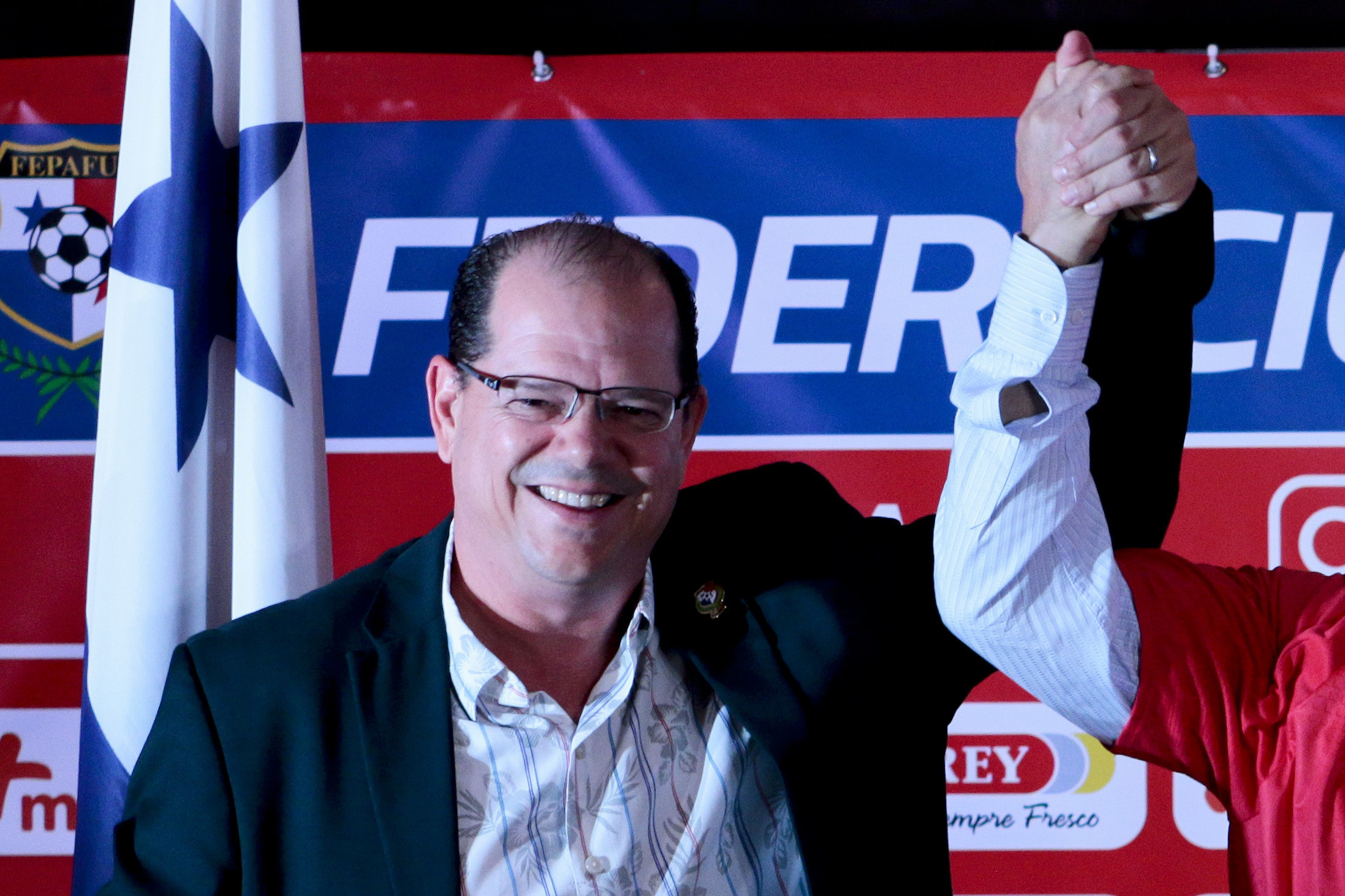 FILE - Panamanian Soccer Federation President Manuel Arias, left, stands with new coach Americo Gallego, during Gallego's media presentation, in Panama City, Aug. 6, 2019. 