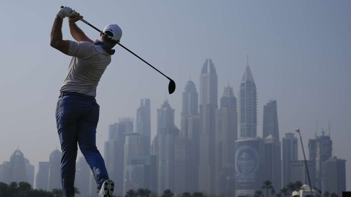 Rory McIlroy of Northern Ireland tees off at 8th hole during the second round of the Dubai Desert Classic golf tournament, in Dubai, United Arab Emirates, Friday, Jan. 17, 2025.