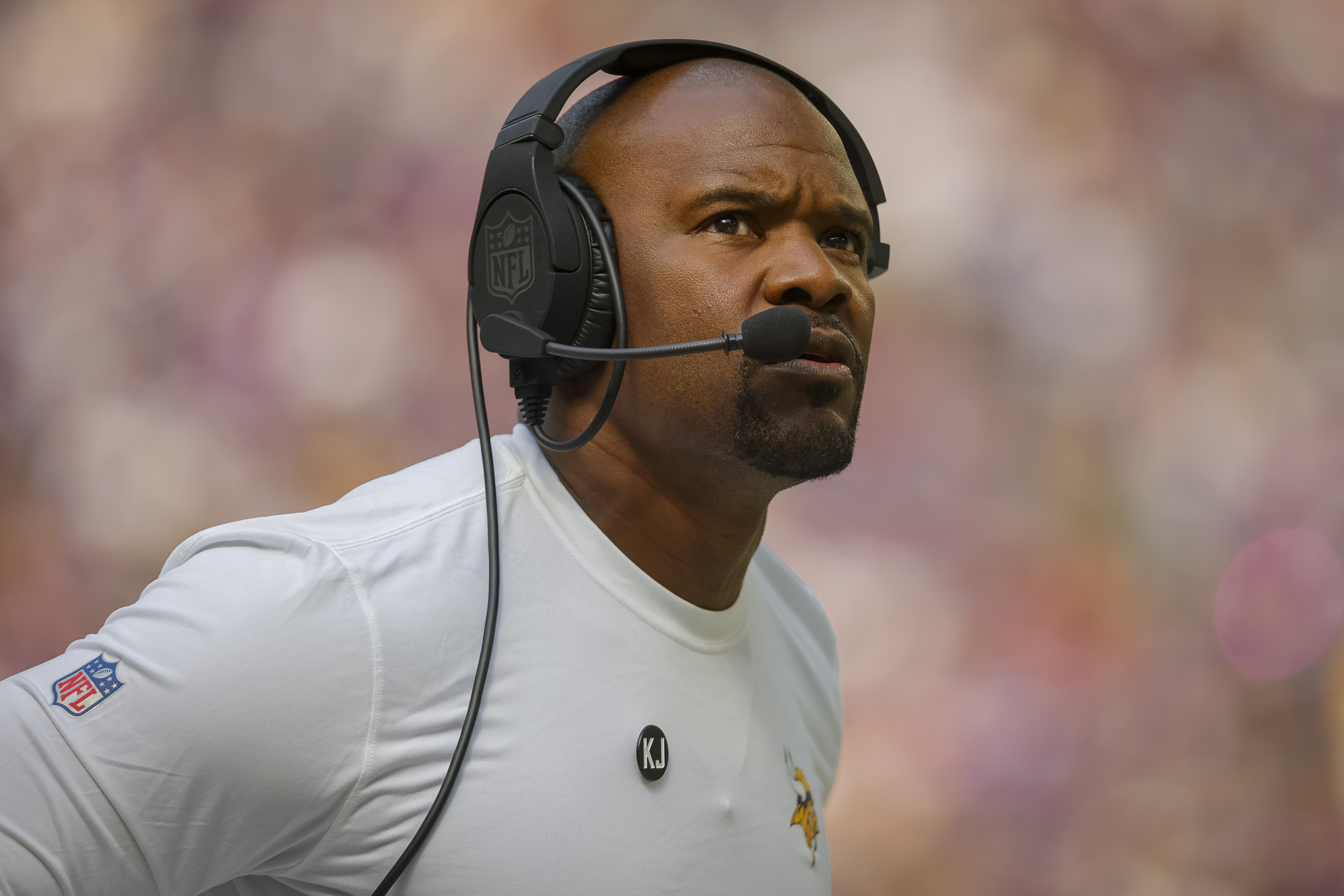 FILE - Minnesota Vikings Defensive coordinator Brian Flores looks to the scoreboard in the first half of an NFL football game against the Houston Texans, Sunday, Sept. 22, 2024, in Minneapolis. 