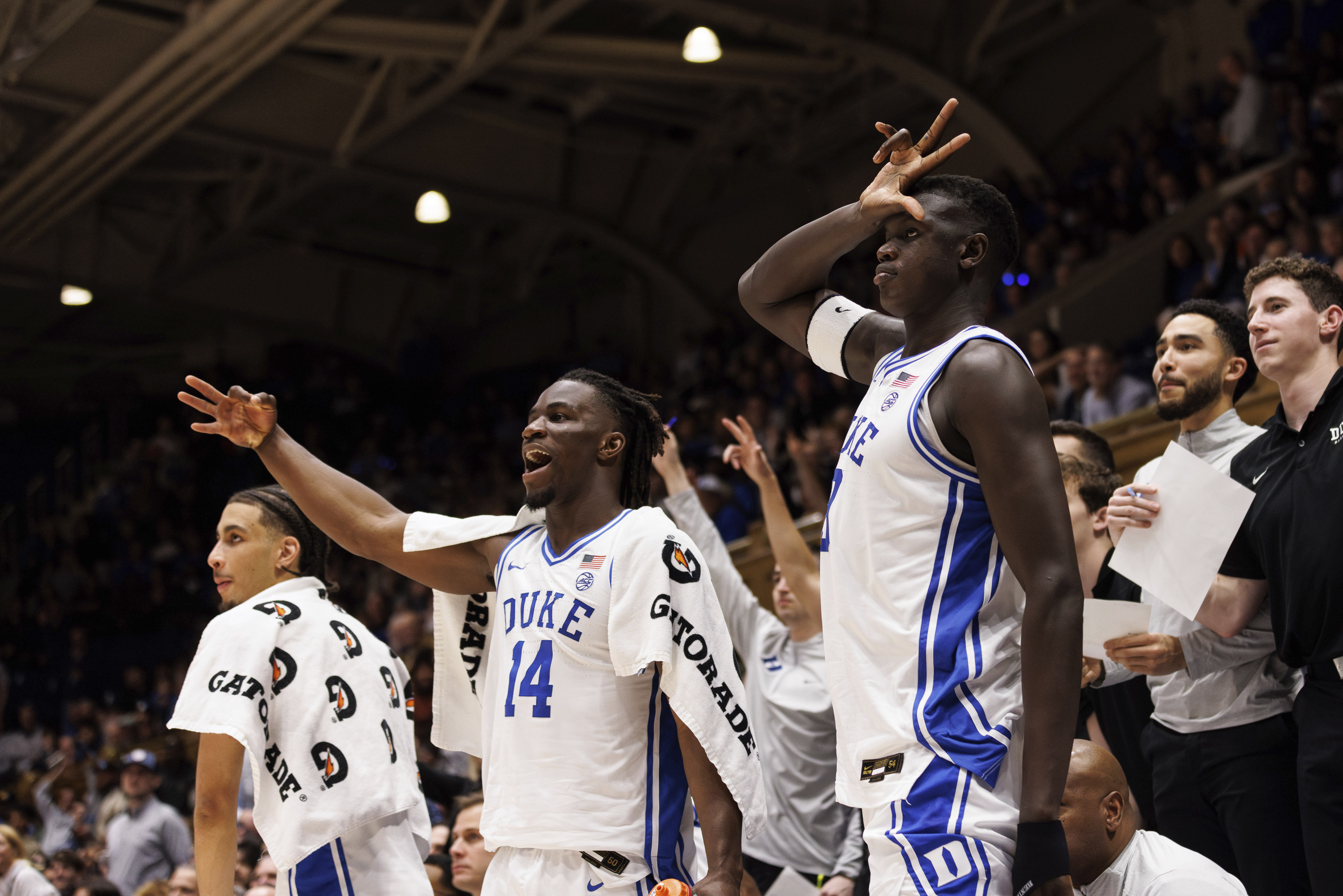 Duke's Sion James (14) and Duke's Khaman Malauch (9) react to a play during the second half of an NCAA college basketball game against Miami in Durham, N.C., Tuesday, Jan. 14, 2025.