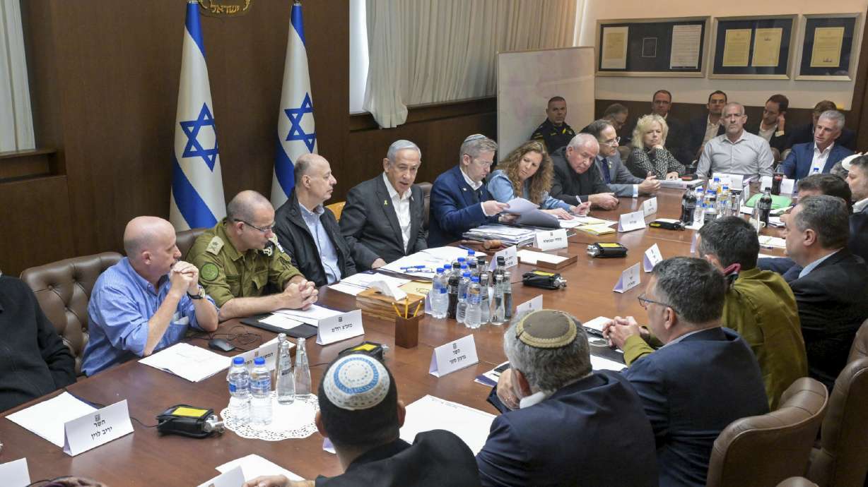 This photo provided by the Israeli Government Press Office, Israeli Prime Minister Benjamin Netanyahu, center, convened his security Cabinet to vote on a ceasefire deal after confirming an agreement had been reached that would pause the 15-month war with Hamas in Gaza, in Jerusalem, Friday.
