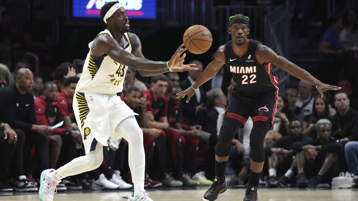 Indiana Pacers forward Pascal Siakam (43) passes as Miami Heat forward Jimmy Butler (22) defends during the first half of an NBA basketball game Thursday, Jan. 2, 2025, in Miami.
