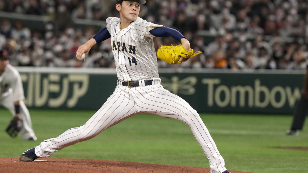 FILE - Japan's Roki Sasak pitches during a Pool B game against the Czech Republic at the World Baseball Classic at the Tokyo Dome, Japan, Saturday, March 11, 2023.