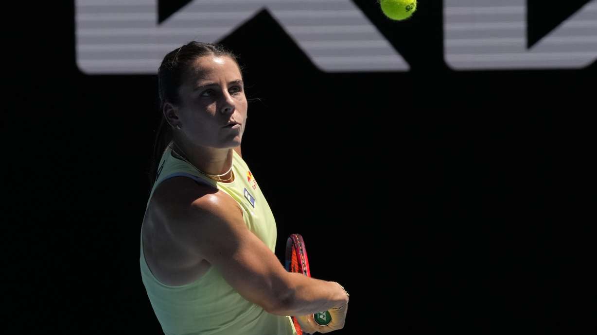 Emma Navarro of the U.S. plays a backhand return to Ons Jabeur of Tunisia during their third round match at the Australian Open tennis championship in Melbourne, Australia, Saturday, Jan. 18, 2025.
