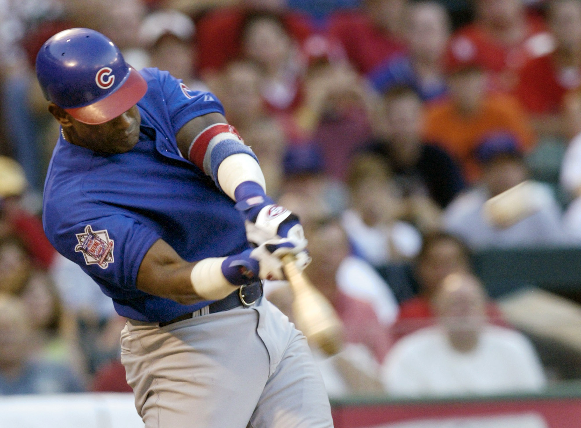 FILE - Chicago Cubs' Sammy Sosa connects for a three-run home run in the third ining against the St. Louis Cardinals Sunday, July 11, 2004 at Busch Stadium in St. Louis.