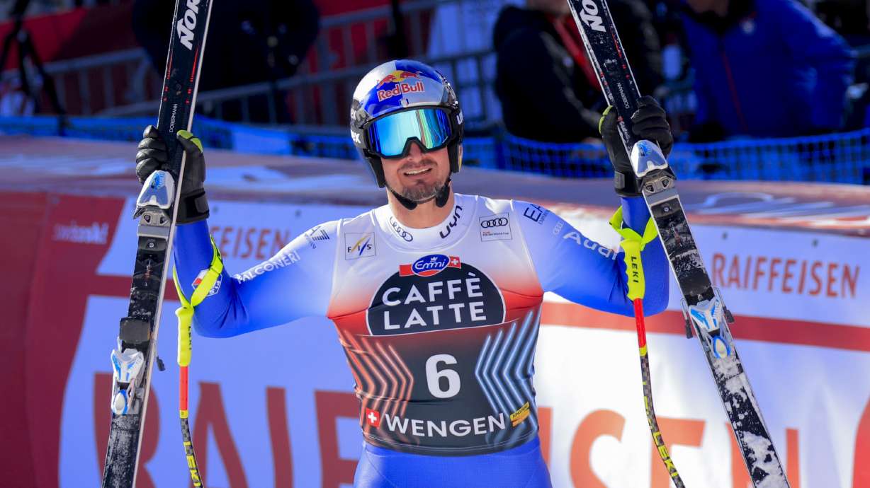 Italy's Dominik Paris celebrates at the finish area of an alpine ski, men's World Cup downhill, in Wengen, Switzerland, Saturday, Jan. 18, 2025