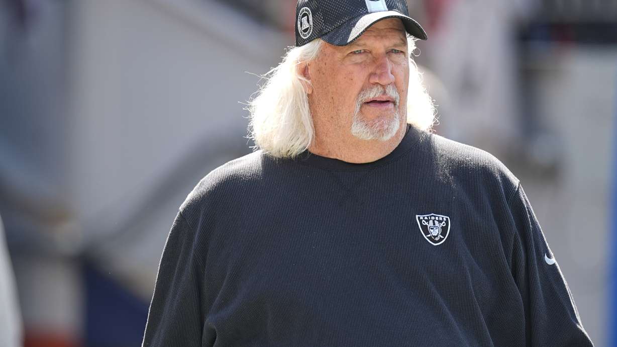 FILE - Las Vegas Raiders senior defensive assistant Rob Ryan stands on the field during an NFL football game in Denver, Oct. 6, 2024.