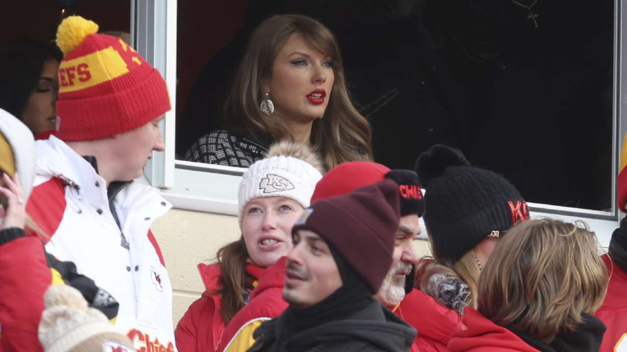 Taylor Swift watches from a suite during the first half of an NFL football AFC divisional playoff game between the Kansas City Chiefs and the Houston Texans Saturday, Jan. 18, 2025, in Kansas City, Mo.