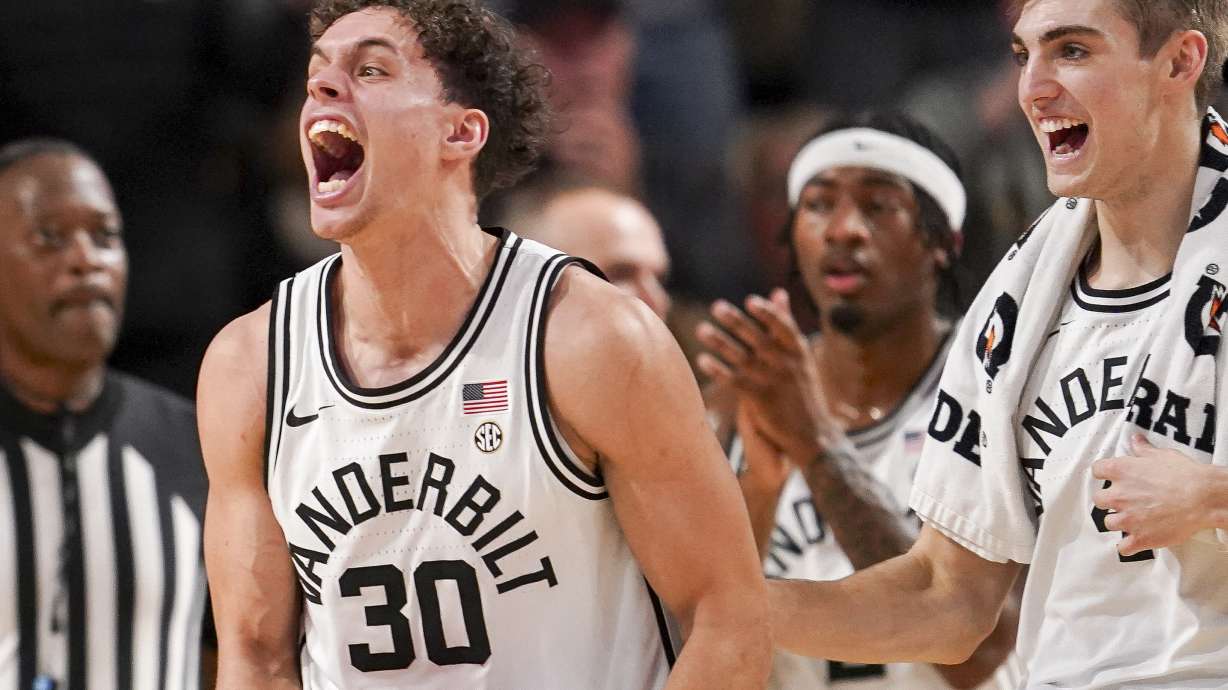 Vanderbilt guard Chris Manon (30) and guard Grant Huffman, right, celebrate during the first half of an NCAA college basketball game against Tennessee, Saturday, Jan. 18, 2025, in Nashville, Tenn.