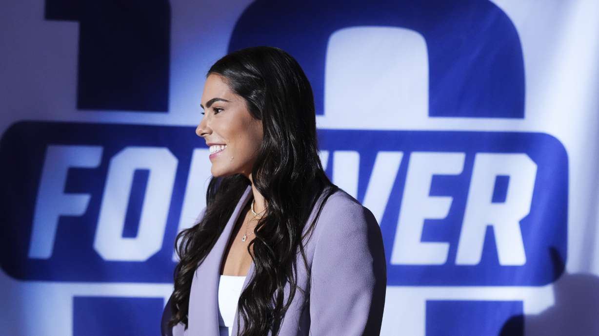 Former Washington guard and current Las Vegas Aces player Kelsey Plum smiles during her jersey retirement ceremony during halftime of an NCAA college basketball game between Washington and Purdue Saturday, Jan. 18, 2025, in Seattle.