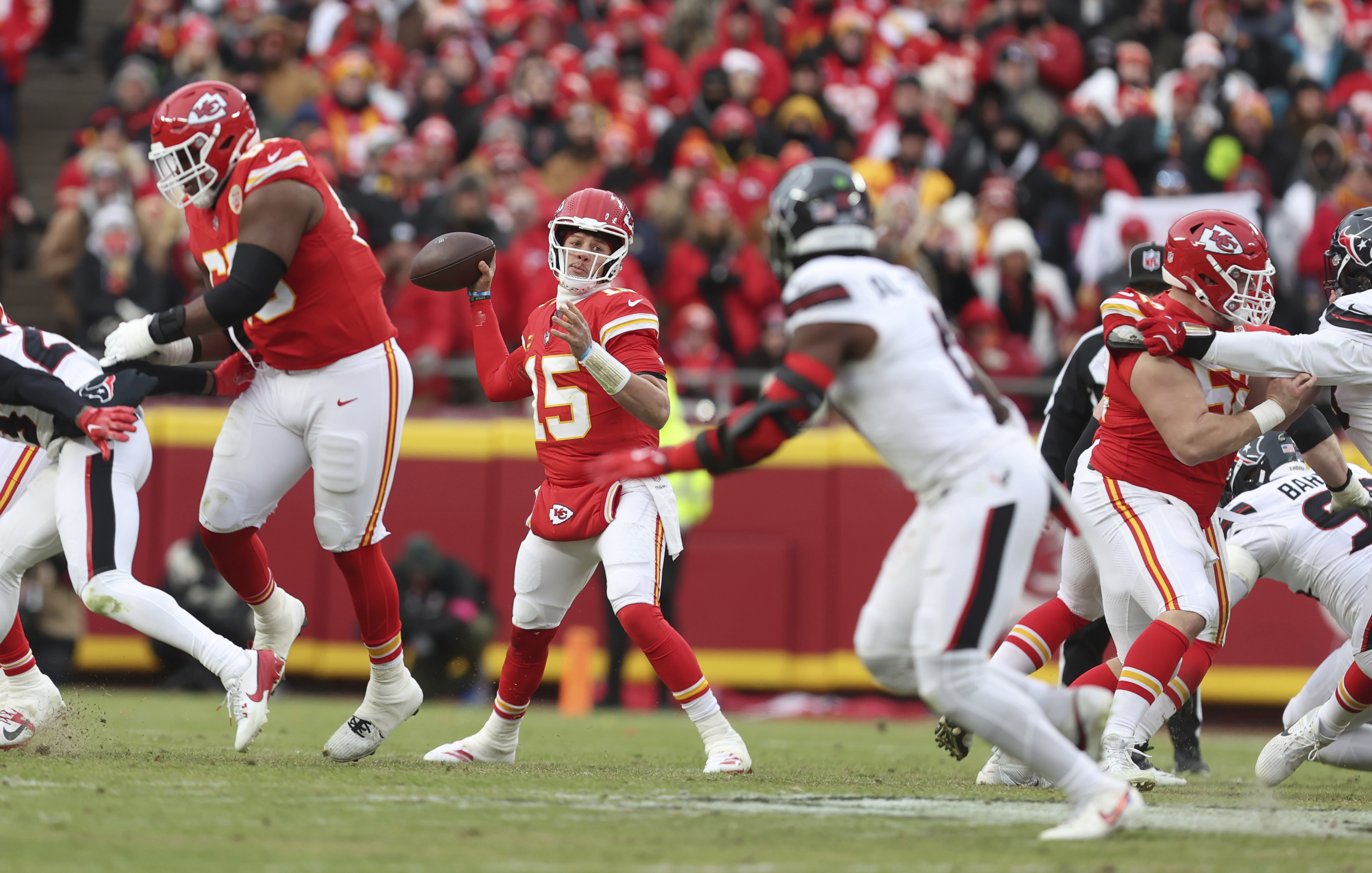 Kansas City Chiefs quarterback Patrick Mahomes (15) throws during the first half of an NFL football AFC divisional playoff game against the Houston Texans Saturday, Jan. 18, 2025, in Kansas City, Mo.