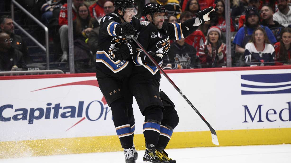 Washington Capitals center Dylan Strome (17) runs into left wing Alex Ovechkin (8) during the first period of an NHL hockey game against the Pittsburgh Penguins, Saturday, Jan. 18, 2025, in Washington.