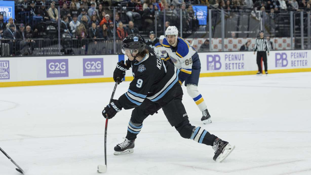 Utah Hockey Club center Clayton Keller (9) shoots the puck against St. Louis Blues left wing Pavel Buchnevich (89) during the first period of an NHL hockey game Saturday, Jan. 18, 2025, in Salt Lake City.