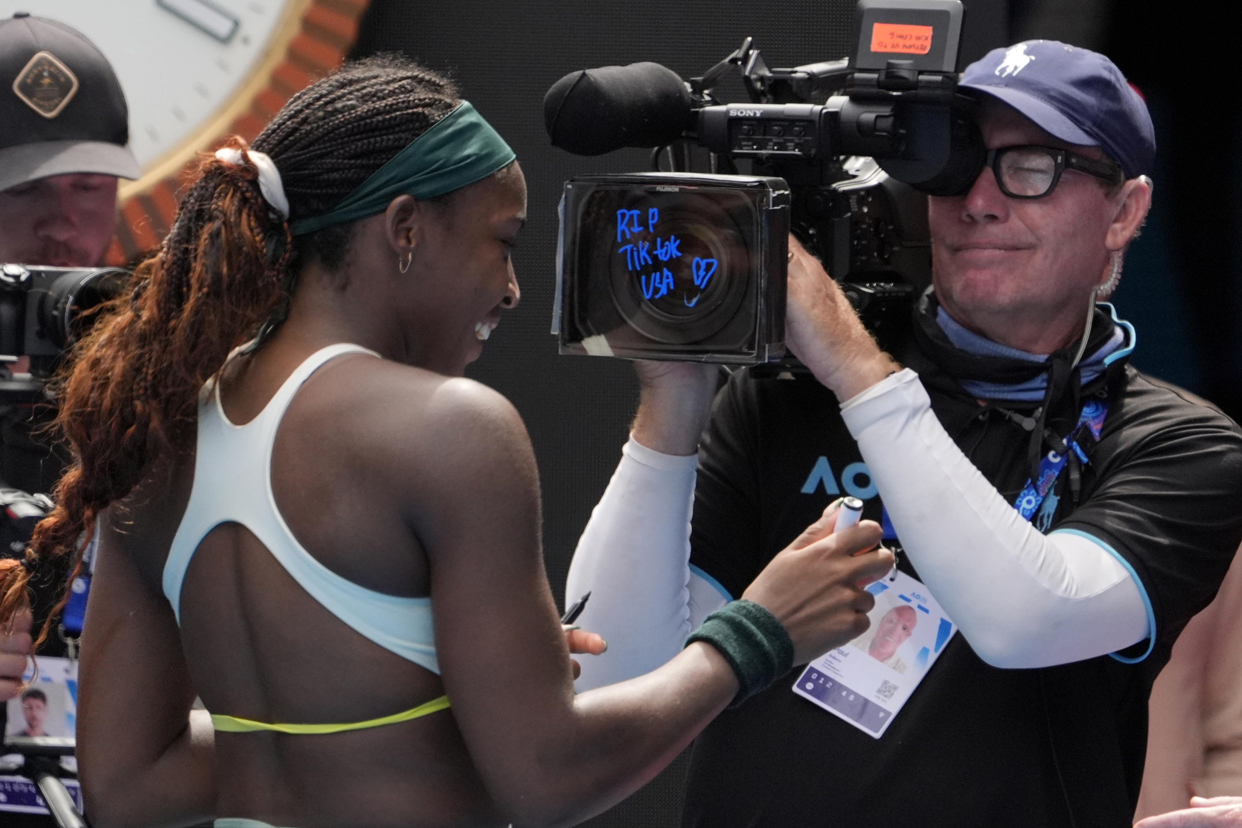 Coco Gauff of the U.S. writes "RIP Tik Tok USA" after defeating Belinda Bencic of Switzerland in a fourth round match at the Australian Open tennis championship in Melbourne, Australia, Sunday, Jan. 19, 2025.