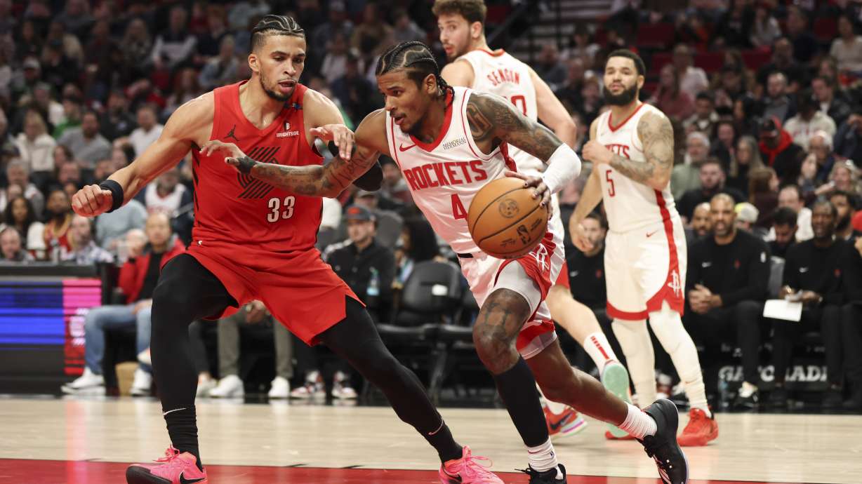 Houston Rockets guard Jalen Green (4) drives upcourt as Portland Trail Blazers forward Toumani Camara (33) defends during the first half of an NBA basketball game Saturday, Jan. 18, 2025, in Portland, Ore.